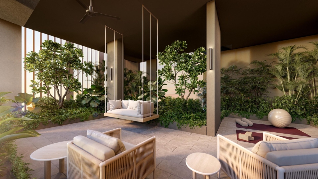 Covered wellness lounge with hanging swing seat and yoga area at The Serra Residences, 7 Bassein Road